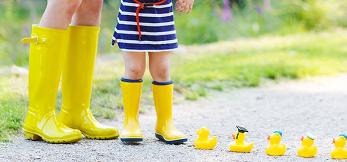 Mom and Child with rubber ducks on pathway