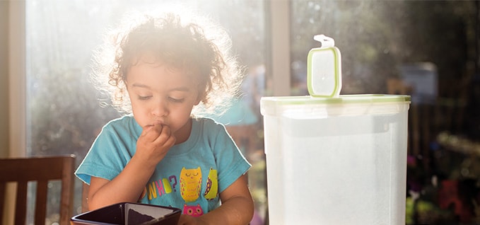 Child with storage container