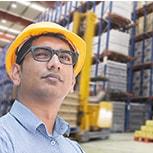 Industrial Worker reviewing plastic pallets