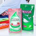 Mom and Child doing laundry with liquid packaging detergent