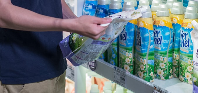 Man reviewing cleaning supplies